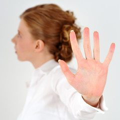 Woman shows the palm of the hand.
