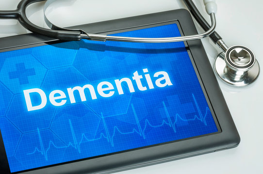 Tablet with the diagnosis dementia on the display