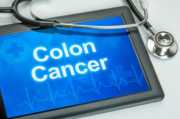 Tablet with the diagnosis colon cancer on the display