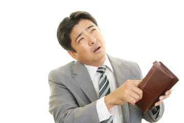 困った表情のビジネスマン
