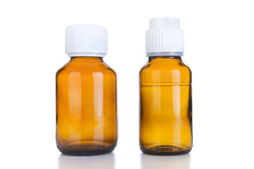 Two Medicine bottle of brown glass or Plastic isolated on white