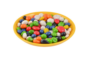 Color candy on plate, isolated on a white background