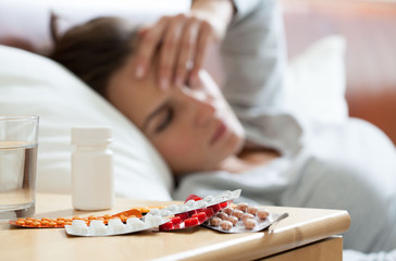 A lot of medicines on night table