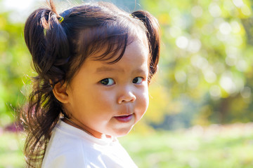 Portrait of little girl smile and looking at camera