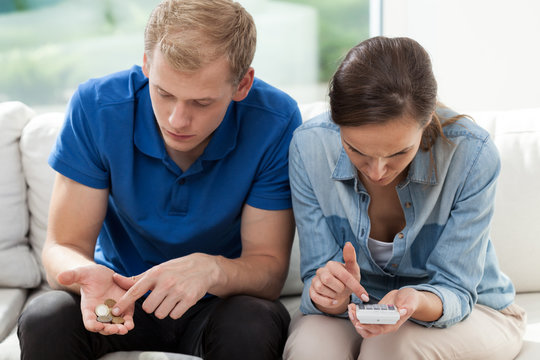 Poor Couple Counting Money