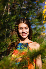 Naklejka premium happy young woman in the autumn wood of the mountain