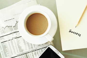 business newspaper and coffee