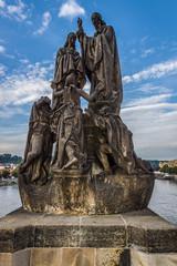 Fototapeta na wymiar Sculpture on the Charles Bridge, Prague. Stylization