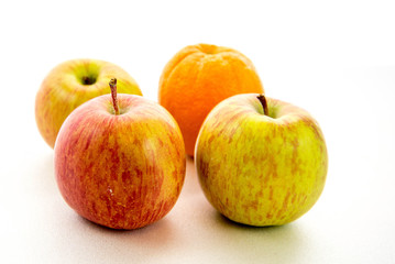 Naklejka na ściany i meble line of apples with one orange