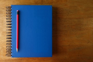 Pencil and a notebook on a table
