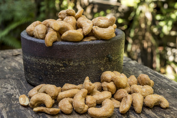Cashew nuts and ceramic bowl