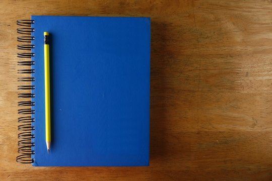 Pencil And A Notebook On A Table