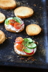Canape with tomato and cucumber