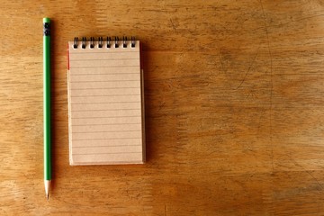 Pencil and a notebook on a table