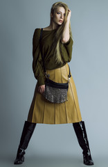 Emotional portrait of a gorgeous fashion blond model  posing ove