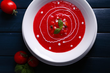 Gazpacho soup on color wooden background