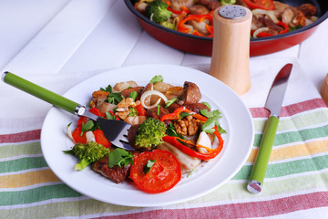 Braised wild mushrooms with vegetables and spices in pan and