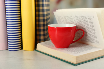 Color cup of tea with books