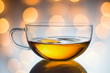 Glass cup of black tea. on light background