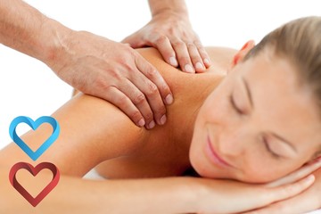 Composite image of serene woman enjoying a massage