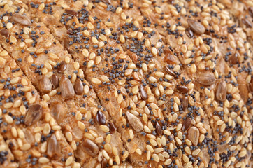 Slices whole grain bread decorated with natural cereals.