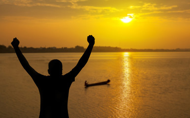 Fototapeta premium Silhouette man on sunset