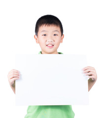 Smiling boy standing with empty horizontal blank paper in hands