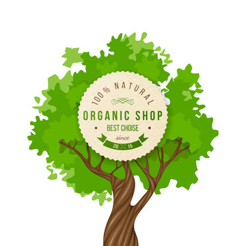 Organic shop emblem over green tree