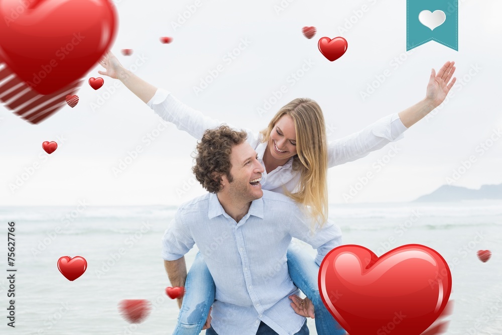 Wall mural Composite image of man piggybacking woman at beach