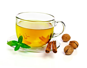 Cup of tea with cinnamon and nuts