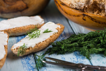 wholegrain bread with fresh dill and soft cheese