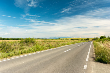 Fototapeta premium Country Road Landscape In Summer