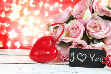 Valentine Card.Roses and Hearts on natural bokeh.