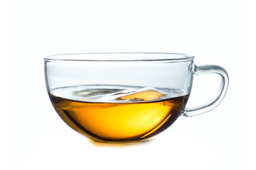 Glass cup of black tea. Isolated on white