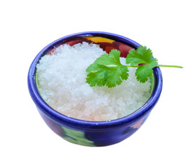 Sea salt and cilantro or coriander isolated on white