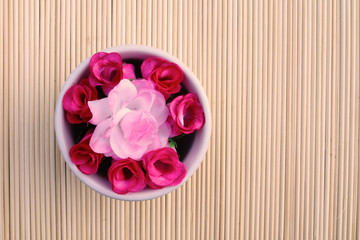 artificial roses in bowl