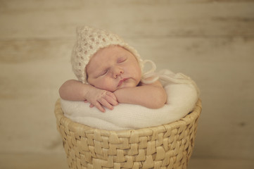 Portrait of Newborn Baby Sleeping on Hands