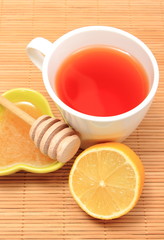 Cup of healthy tea with honey and lemon