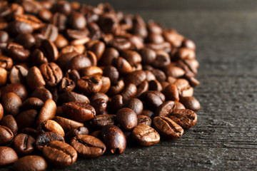 Coffee beans on wooden background
