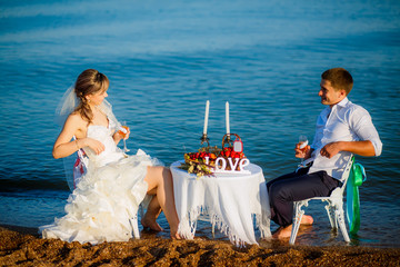 happy bride and groom on the beach