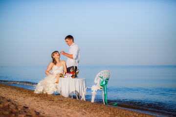 happy bride and groom on the beach