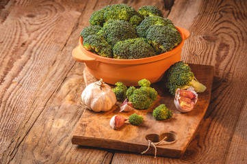 Green delicious broccoli on a wooden rustic table