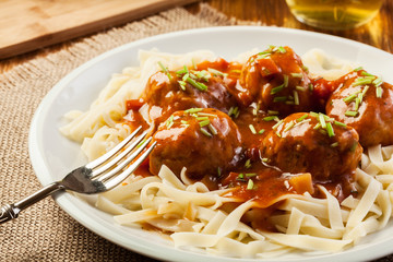 Pasta fettuccine and meatballs with tomato sauce