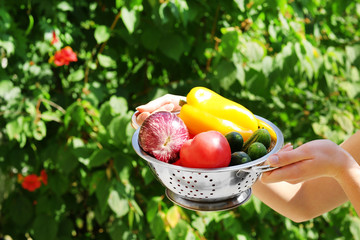 Washing vegetables, outdoors