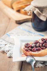 Strawberry Jam, bread on the table background