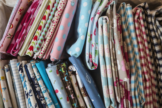 Selection of colourful sewing fabrics.