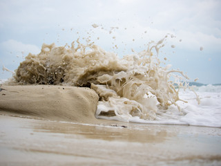 Waves crashing on the sand