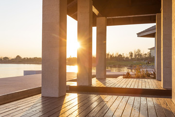 resort lakeside pavilion at sunset