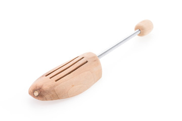 Wooden shoe tree isolated on white background