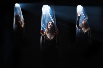 agoraphobia 3 girls woman inside a plastic bag,  bright light - obrazy, fototapety, plakaty
